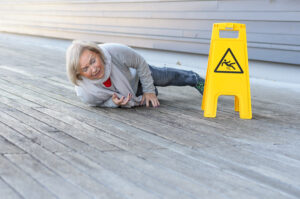 Senior Lady Slipping And Falling On A Wet Surface